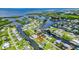 Expansive aerial view showcases waterfront homes on canals, offering direct boating access at 24277 Treasure Island Blvd, Punta Gorda, FL 33955