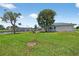 Well-maintained lawn leads to a private boat dock, highlighting backyard waterfront appeal at 24277 Treasure Island Blvd, Punta Gorda, FL 33955