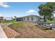 Exterior of a home featuring a spacious backyard, boat trailer, and easy waterfront access at 24277 Treasure Island Blvd, Punta Gorda, FL 33955