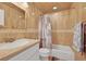 Bathroom featuring tiled walls, a single vanity, and a shower-tub combination at 24277 Treasure Island Blvd, Punta Gorda, FL 33955