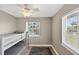 Cozy bedroom with bunk beds, wood floors, and windows overlooking the waterway at 24277 Treasure Island Blvd, Punta Gorda, FL 33955