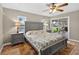 This bedroom features an en suite bathroom, stylish furniture, and access to an outdoor patio at 24277 Treasure Island Blvd, Punta Gorda, FL 33955