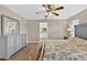 This bedroom features stylish furniture, wood floors, and an en suite bathroom at 24277 Treasure Island Blvd, Punta Gorda, FL 33955
