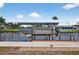 Modern boat lift on the waterway, offering convenient and protected boat storage at 24277 Treasure Island Blvd, Punta Gorda, FL 33955