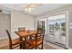 Inviting dining area with a view of the lanai and waterfront through sliding glass doors at 24277 Treasure Island Blvd, Punta Gorda, FL 33955
