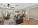 Comfortable living room featuring stylish decor, wood flooring, and a welcoming entryway at 24277 Treasure Island Blvd, Punta Gorda, FL 33955