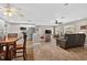 Open-concept living space with kitchen, dining area, and living room featuring lots of natural light at 24277 Treasure Island Blvd, Punta Gorda, FL 33955