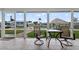 A screened-in patio featuring tiled floors and a beautiful waterfront view at 24277 Treasure Island Blvd, Punta Gorda, FL 33955