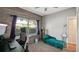 Bright bedroom with modern colors, chair rail, built in shelving and plenty of natural light at 6020 Illinois Ave, New Port Richey, FL 34653