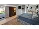 Modern bedroom with ensuite bathroom, workspace, and large windows for plenty of natural light at 6020 Illinois Ave, New Port Richey, FL 34653
