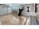 Bonus room featuring a sliding barn door, light colored floors, and an exercise machine at 6020 Illinois Ave, New Port Richey, FL 34653