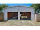 Spacious detached two-car garage showcasing ample storage and parking for two trucks at 6020 Illinois Ave, New Port Richey, FL 34653