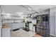 Modern kitchen with stainless steel appliances, light cabinets and countertops, and ample storage space at 6020 Illinois Ave, New Port Richey, FL 34653