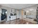 Bright kitchen featuring white cabinets, hardwood floors, and modern appliances at 6020 Illinois Ave, New Port Richey, FL 34653