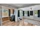 Bright laundry room with modern washer/dryer, shiplap accents, and ample natural light at 6020 Illinois Ave, New Port Richey, FL 34653
