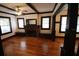 Bright living room featuring hardwood floors, a brick fireplace, and natural light at 834 Jackson N St, St Petersburg, FL 33705