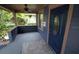 Inviting front porch with a decorative door, ceiling fan, and space for seating at 834 Jackson N St, St Petersburg, FL 33705