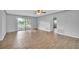 Bright living room featuring sliding glass doors and tile flooring at 101 N Nimbus Ave, Clearwater, FL 33765