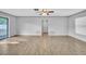 Open-concept living area with tile floors and a ceiling fan at 101 N Nimbus Ave, Clearwater, FL 33765