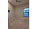 This bedroom features carpet, neutral walls, and a window with blinds at 12513 Oak Hill Way, Parrish, FL 34219