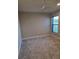 Comfortable bedroom with carpet, neutral walls, and a window with blinds at 12513 Oak Hill Way, Parrish, FL 34219