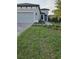 Charming single Gathering home featuring a well-manicured lawn and paver walkway at 12513 Oak Hill Way, Parrish, FL 34219