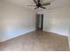 Bedroom with neutral walls, tile floors and an open door at 141 Angol St, Punta Gorda, FL 33983