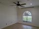 Bedroom featuring an arched window letting in natural light at 141 Angol St, Punta Gorda, FL 33983