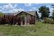 Exterior view of the house with colorful landscaping and a well-maintained lawn at 141 Angol St, Punta Gorda, FL 33983