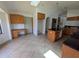 Open kitchen with an island, granite countertops, and wooden cabinets, seamlessly blending style and functionality at 141 Angol St, Punta Gorda, FL 33983