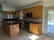 Well-equipped kitchen with granite countertops, stainless steel appliances, ample cabinet space, and an island at 141 Angol St, Punta Gorda, FL 33983