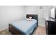 Cozy bedroom featuring a comfortable bed, neutral carpet, and a sunny window perfect for relaxing at 28761 Sweet Persimmon Dr, Wesley Chapel, FL 33543