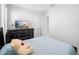 Inviting bedroom with a dresser, TV, and natural light, complemented by neutral tones for relaxation at 28761 Sweet Persimmon Dr, Wesley Chapel, FL 33543