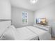 Inviting bedroom with a comfortable bed, neutral decor, and a TV for relaxation and entertainment at 28761 Sweet Persimmon Dr, Wesley Chapel, FL 33543