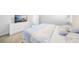 Comfortable bedroom with dresser and a view of a flat screen television, offering a cozy retreat at 28761 Sweet Persimmon Dr, Wesley Chapel, FL 33543
