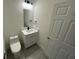 A modern bathroom with sleek white cabinets, black fixtures, and a rectangular mirror at 10153 Wildcat St, Port Charlotte, FL 33981