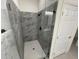Contemporary bathroom featuring a shower with sleek gray tiles and glass door at 10153 Wildcat St, Port Charlotte, FL 33981