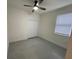 Comfortable bedroom with a ceiling fan and a window at 10153 Wildcat St, Port Charlotte, FL 33981