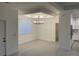 Well-lit dining room featuring decorative tray ceilings and hardwood floors at 10153 Wildcat St, Port Charlotte, FL 33981