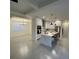 Bright and airy kitchen with an island, stainless steel appliances, and an adjacent dining area at 10153 Wildcat St, Port Charlotte, FL 33981