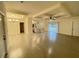 Spacious living room featuring hardwood floors, recessed lighting, and a ceiling fan at 10153 Wildcat St, Port Charlotte, FL 33981