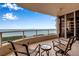 Balcony with comfortable seating offers stunning water views, creating the perfect spot for relaxation and enjoyment at 3010 Grand Bay Blvd # 472, Longboat Key, FL 34228