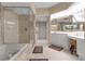 Bathroom with a soaking tub and glass enclosed shower at 3010 Grand Bay Blvd # 472, Longboat Key, FL 34228