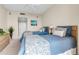 This bedroom features a pair of twin beds with blue and white patterned bedding and rattan headboards at 3010 Grand Bay Blvd # 472, Longboat Key, FL 34228