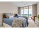 Bedroom with two twin beds and balcony access with a view at 3010 Grand Bay Blvd # 472, Longboat Key, FL 34228