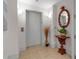 Elevator lobby with elegant mirror, tiled floor, and decorative accents offers convenient and refined building access at 3010 Grand Bay Blvd # 472, Longboat Key, FL 34228