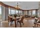 Elegant open-plan living room features floor-to-ceiling windows with panoramic water views and comfortable seating at 3010 Grand Bay Blvd # 472, Longboat Key, FL 34228