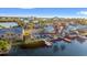 An aerial view of waterfront homes, lush landscaping, private docks, and canals leading to the ocean at 328 6Th Ave, Indian Rocks Beach, FL 33785