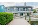 Beautiful backyard with a dock, waterfront access, and outdoor seating for relaxation and entertainment at 328 6Th Ave, Indian Rocks Beach, FL 33785