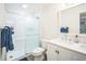 Bathroom featuring new sliding glass shower, vanity, mirror, and fixtures at 328 6Th Ave, Indian Rocks Beach, FL 33785